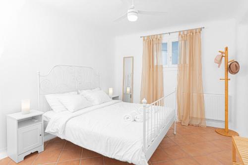 Posteľ alebo postele v izbe v ubytovaní Tranquil Villas by Whitelist Mykonos