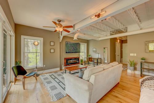 a living room with a couch and a fireplace at Falcons Nest in McCaysville