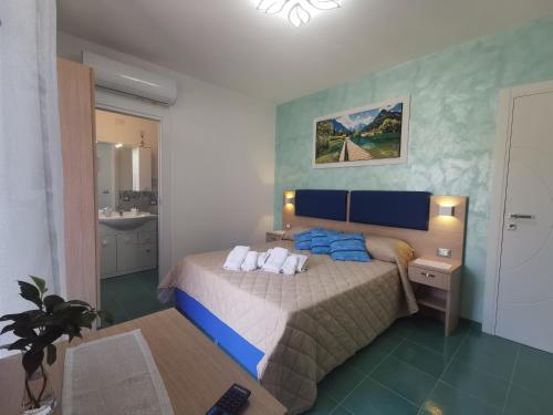 a bedroom with a bed with two pillows on it at Astra in Agerola
