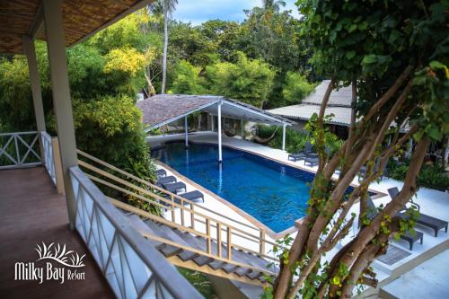 The swimming pool at or close to Milky Bay Resort