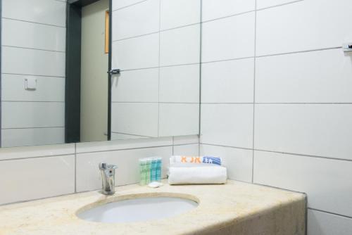 a bathroom counter with a sink and a mirror at HI - Tel Hai Hostel in Tel H̱ay