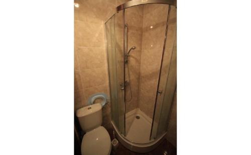a bathroom with a shower and a toilet at Sea View Apartment PRESTIGE FORT BEACH , PREMIER FORT BEACH in Sveti Vlas
