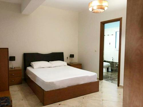 Posteľ alebo postele v izbe v ubytovaní Melina Apartment