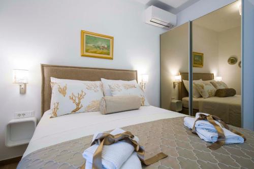 Ліжко або ліжка в номері Amaris luxury apartments