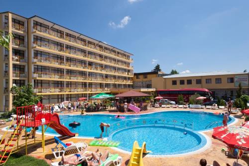 a large swimming pool with a slide and a playground at Hotel Trakia Garden in Sunny Beach