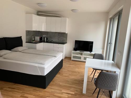 Кровать или кровати в номере Residence Port Karolina