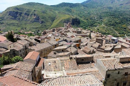 an aerial view of a village with mountains in the background at Agliata 138 in Petralia Sottana