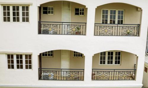 a facade of a building with a balcony at Apartment Royale Hotel-3 Bd Apartment in Ikeja