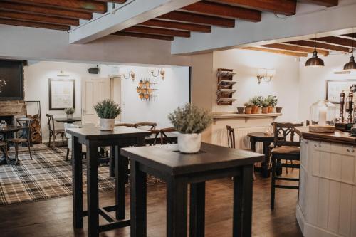 A restaurant or other place to eat at The Woodman Inn 