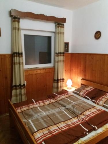 Posteľ alebo postele v izbe v ubytovaní Badacsonyi Lugas apartmanok