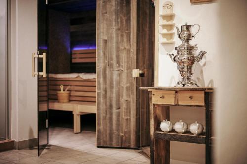 a room with a table with a trophy on it at der klostertalerhof in Klösterle am Arlberg