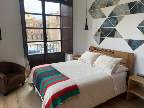 Posteľ alebo postele v izbe v ubytovaní Apartamentos Plaza Mayor Zamora