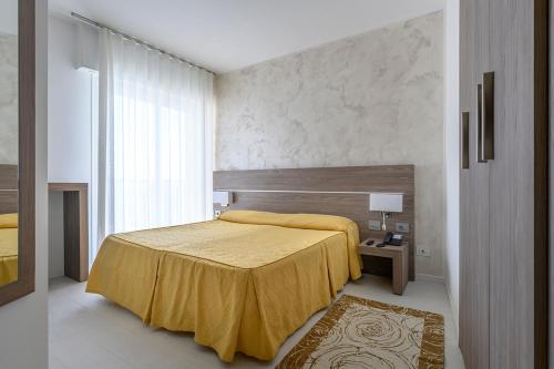 Voodi või voodid majutusasutuse Hotel Capri 3 Stelle SUPERIOR toas
