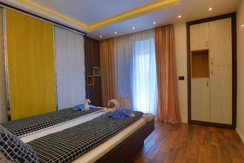 Postel nebo postele na pokoji v ubytování Bella apartments