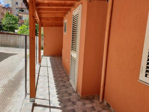 a corridor of a building with an open door at Vacation Apartment near the lake Apartament afer liqenit in Pogradec