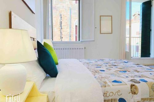 a bedroom with a large bed and a window at chiesa dei madonna orto room in Venice