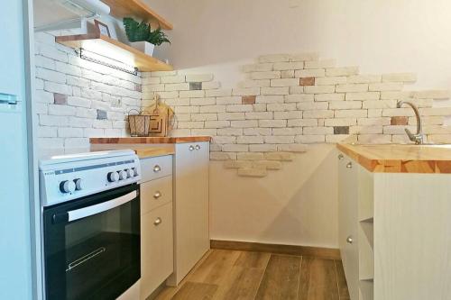 a kitchen with a stove and a sink at Alkyoni by KRISSES in Míloi