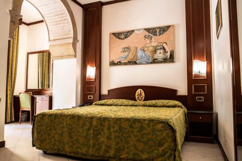 Hotel Garibaldi tesisinde bir odada yatak veya yataklar