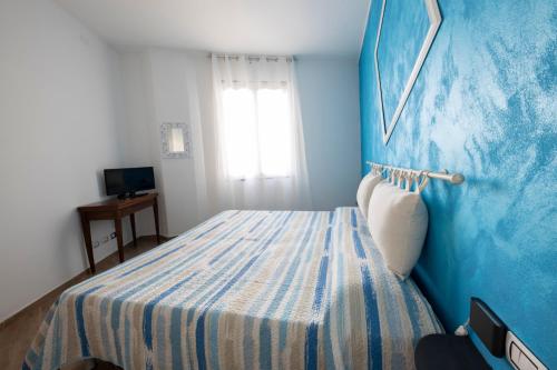 מיטה או מיטות בחדר ב-Looky Hotel