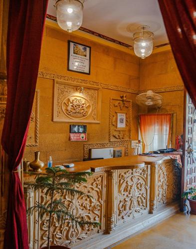 a kitchen with a wooden counter top in a room at Hotel Lal Garh Fort And Palace in Jaisalmer