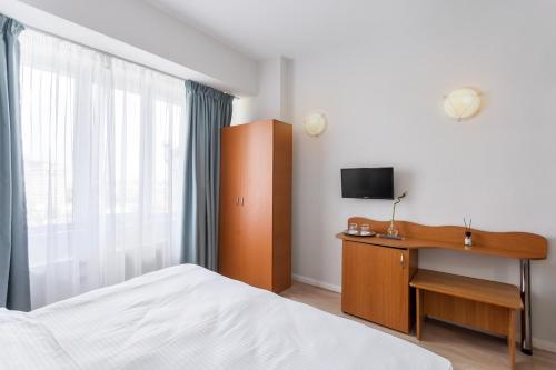 Cama o camas de una habitación en Elizeu Hotel