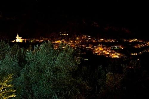 a view of a city at night with lights at Fabulous Rustic Villa Set On Mountain With Unique Views in Valldemossa