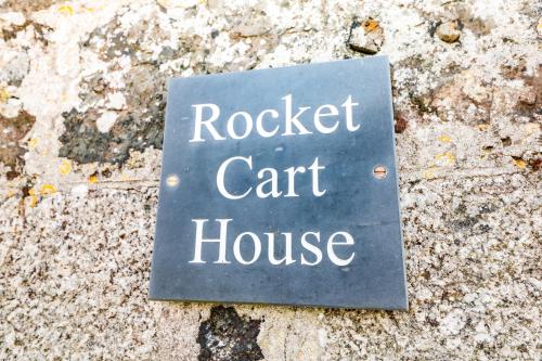 a sign that reads rocket car house on the ground at Rocket Cart House in Landewednack