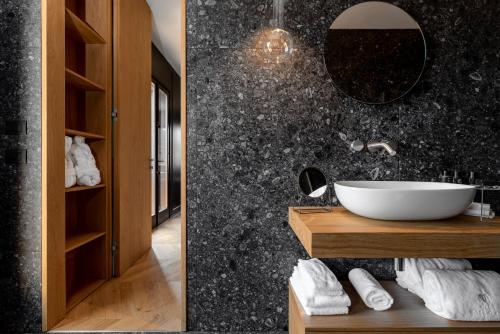 a bathroom with a sink and a mirror at Relais Villa Margherita in Longiano