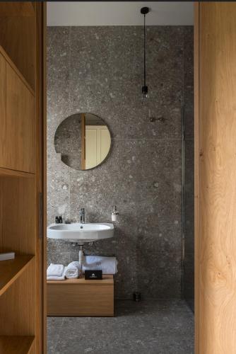 a bathroom with a sink and a mirror at Relais Villa Margherita in Longiano