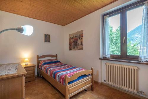 Ein Bett oder Betten in einem Zimmer der Unterkunft Casa da Ester Marter di Roncegno OSPITAR