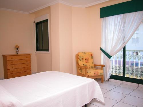 Postel nebo postele na pokoji v ubytování Apartamentos Cormoran