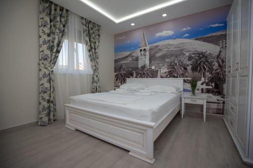 Postel nebo postele na pokoji v ubytování Villa Rita