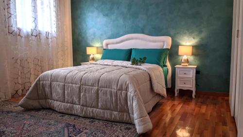 A bed or beds in a room at La Collina delle Acacie