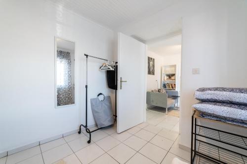 a bedroom with a door open to a bedroom with a bed at Simple Pleasures Home in Kavala