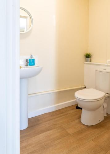 a bathroom with a toilet and a sink at 37A Parker House in Salisbury