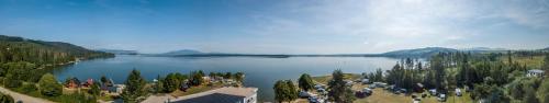a view of a lake with a group of people at Hotel Prístav in Trstená