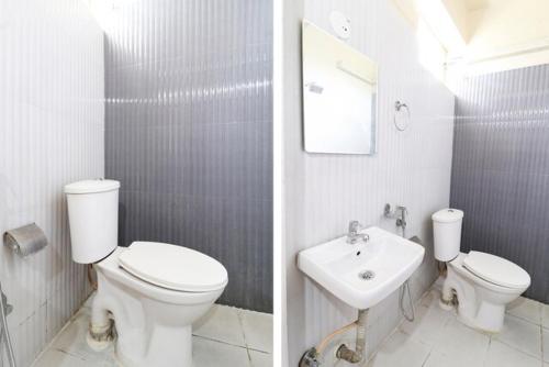 Un baño blanco con inodoro y lavabo. en Palm Rooms Near CHRISTH UNIVERSITY&DAIRY CIRCLE, en Bangalore