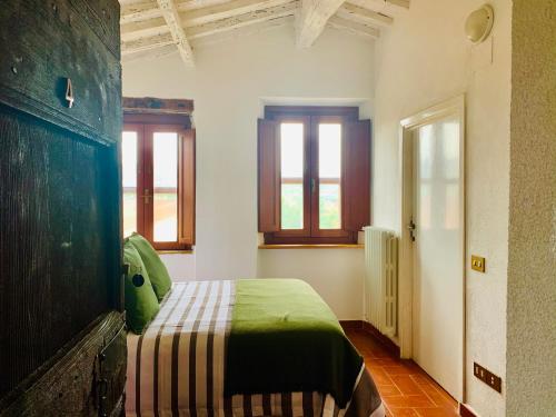 Postel nebo postele na pokoji v ubytování B&B VALLE D'ORO