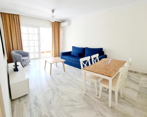 Et opholdsområde på Apartamentos Pueblo Quinta