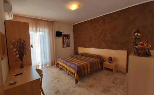 Un pat sau paturi într-o cameră la B&B Raggio Di Sole