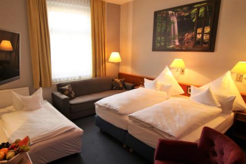 เตียงในห้องที่ Hotel Mohr & Spa