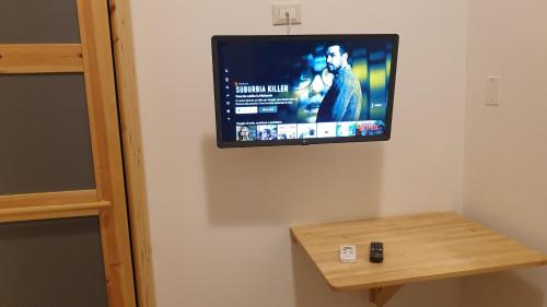TV a/nebo společenská místnost v ubytování Affittacamere Raggio di sole