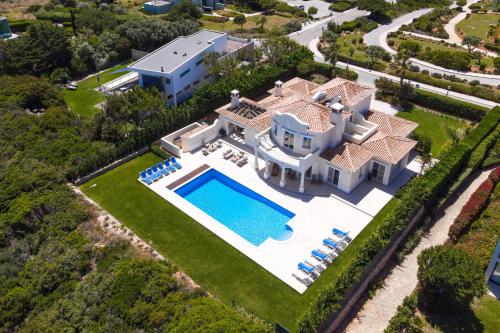 an aerial view of a house with a swimming pool at Sea View Villa in Sagres