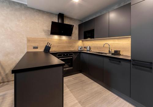 Kuchyň nebo kuchyňský kout v ubytování Gesto Apartments