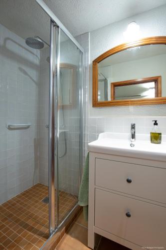 a bathroom with a sink and a shower at Mas Teixidor, Masia entre Girona y la Costa Brava in Caldes de Malavella