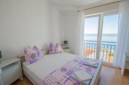 Posteľ alebo postele v izbe v ubytovaní Apartmani Sil