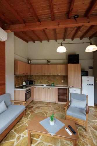 a living room with a couch and a table at Wooden House in Mesimérion