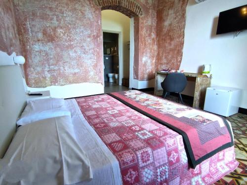Кровать или кровати в номере Tenuta di Venere