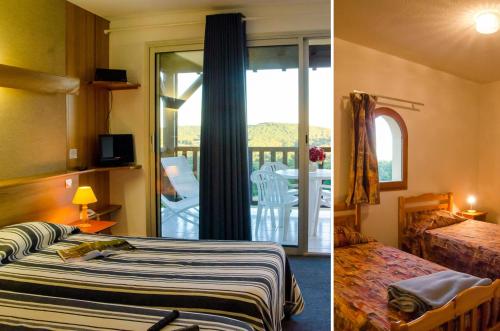 a hotel room with two beds and a balcony at Résidence Les Hauts de Marquay in Marquay