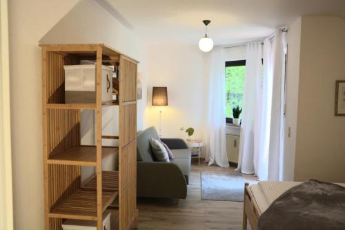 a living room with a book shelf and a couch at Ferienwohnung Traumzeit in Cochem